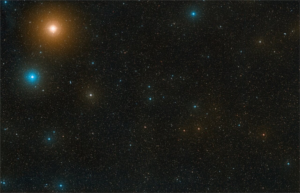 Astronomers Witness Newborn Planet Sculpting the Dust Around It Wide-field view of area of sky around the star European Southern Observatory (ESO) &copy;