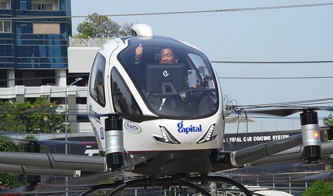 1st Urban Sandbox Human-Carrying Flight of Pilotless eVTOL with CAAT Director-General Aboard  EHang &copy;